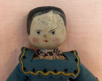 Lula, an antique wooden doll in period clothing