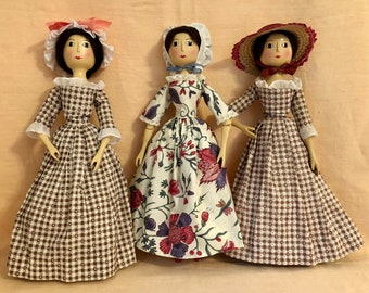 Fred Laughon's vintage wooden doll, "Charity", original and redressed versions