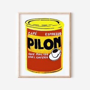 May include: A yellow and red can of Pilon Cafe Espresso ground coffee with the text "Cafe Espresso Pilon Cafe Molido 100% Coffee" and a small illustration of a white coffee cup with brown coffee.