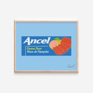 May include: A framed illustration of a vintage-style product label for Ancel Guava Paste. The label features a blue background with white text and a red and pink guava fruit illustration. The text reads "Ancel Guava Paste Pasta de Guayaba".