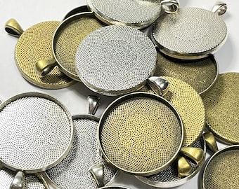 May include: A group of round metal pendant trays with a textured surface. The trays are in silver and gold tones.