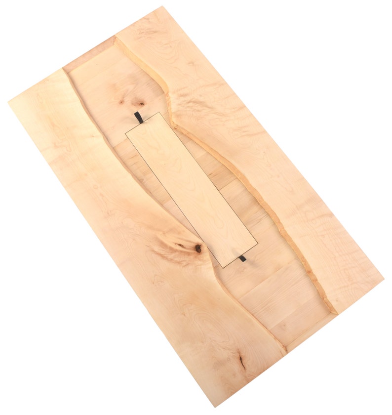 May include: A light wood table top with a natural edge and a rectangular cutout in the center.