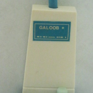 May include: A blue and white plastic toy vacuum cleaner with the words "GALOOB" and "FUN  REAM" printed on it.