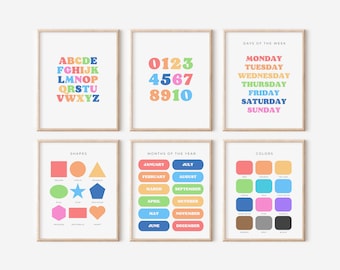 May include: Set of 6 colorful educational posters for kids featuring the alphabet, numbers, days of the week, months of the year, shapes, and colors. Each poster has a different color scheme and features bold, easy-to-read text.