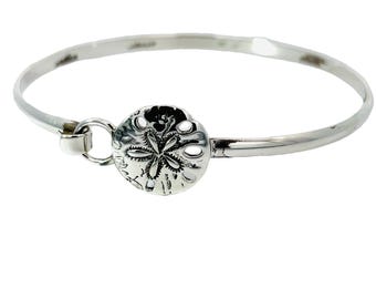 Handmade 925 Silver Sand Dollar bracelet. Handmade on Cape Cod by Michael's Jewelers. Free Shipping in box with free polish cloth.