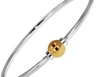 Beach Ball Bracelet Made on Cape Cod. with screwball 14k solid ball gold.  Original oval shape to fit wrist better.