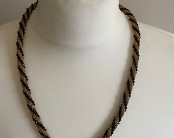 Braided gold-tone chain and black bead necklace with magnetic clasp, 1960’s