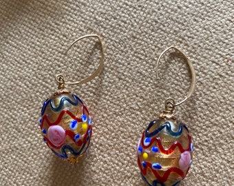 Beautiful oval   Multi-colored lamp-work Venetian bead earrings hung from a gold vermeil ear wire