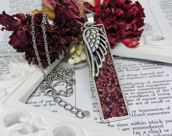 Memorial flower pendant necklace with angel wing charm made from your dried funeral flowers. Ask about using cremations, hair or fabric.
