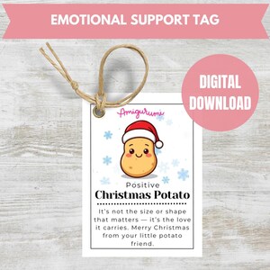 May include: A white tag with a cartoon potato wearing a Santa hat, the text "Positive Christmas Potato", and the words "Emotional Support Tag" and "Digital Download". The tag is tied with twine.