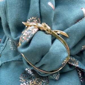 The Bow Scarf Ring, gold finish, designed and handmade in the UK