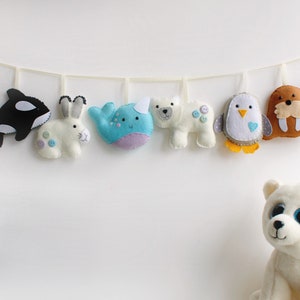 Make Your Own felt Polar Garland Kit. Makes full set of 8 decorations. Felt penguin, walrus, narwhal, Arctic hare, orca, igloo, Polar bear.