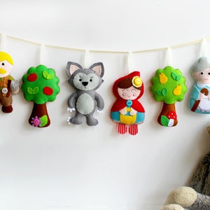 Make Your Own felt Little Red Riding Hood Garland kit. Full materials and patterns to make 6 all 6 decorations.