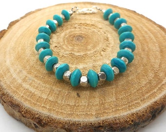 Bracelet perles de bois turquoises et argentées