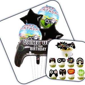 May include: A collection of birthday party decorations with a gaming theme. Includes black star-shaped balloons, round balloons with controller graphics, and a large controller-shaped balloon. Also includes cupcake toppers and a cake topper.