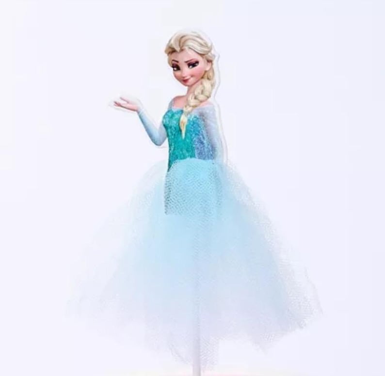May include: A cutout of a cartoon character, a woman with blonde hair in a side braid, wearing a teal and blue dress with a tulle skirt. The character is posed with one arm outstretched.