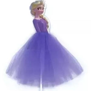 May include: A purple princess-themed cake topper featuring a cartoon character in a long, flowing purple dress. The character has blonde hair in a side braid and is smiling. The dress has a fitted bodice and a full, layered skirt.
