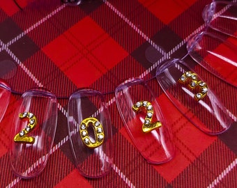 Amuletos de uñas de Año Nuevo 2023