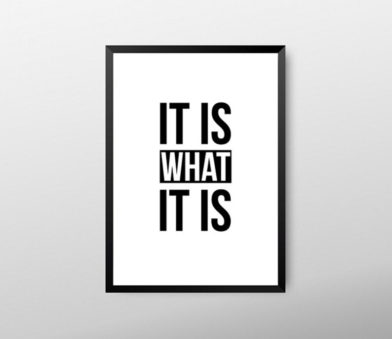 May include: Framed wall art with the phrase "IT IS WHAT IT IS" in bold, black capital letters on a white background. The artwork is encased in a black frame, suitable for home or office decor.