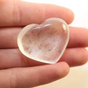 Clear Optical Quartz Carved and Polished Into A Heart Shaped Cabochon-Polished Palm Stone Absorbs, Stores, Releases, Regulates Energy