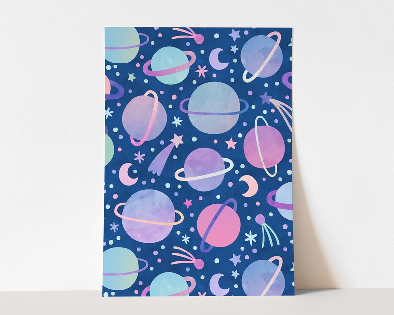 May include: A seamless pattern featuring pastel-colored planets with rings on a dark blue background. The planets are surrounded by stars and shooting stars.