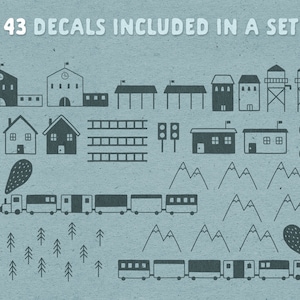 May include: A set of 43 black and white decals featuring a train, houses, mountains, trees, and other train-related imagery. The text "43 DECALS INCLUDED IN A SET" is at the top of the image.