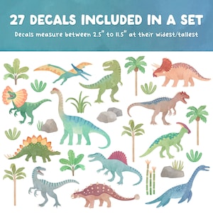 May include: A set of 27 dinosaur decals featuring various species, palm trees, and rocks. The text reads 27 DECALS INCLUDED IN A SET and Decals measure between 2.5" to 11.5" at their widest/tallest. The illustrations are rendered in watercolor style.