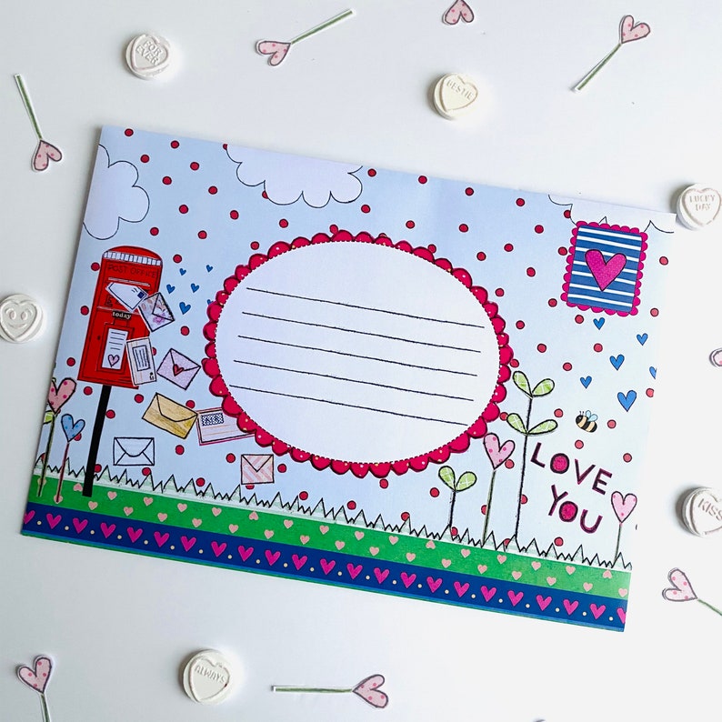 May include: A blue and white envelope with a red mailbox, hearts, and the text "LOVE YOU".