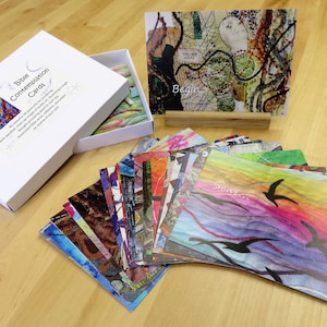 May include: A set of 40 Bible contemplation cards featuring colourful abstract art and inspirational words. The cards are presented in a white box with a blue and white design. The box is labelled "Bible Contemplation Cards".