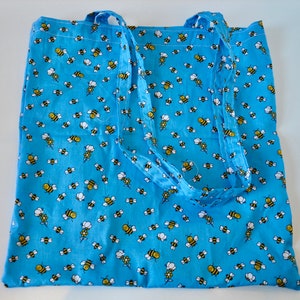 A delightful, handmade, tote bag with bees as the pattern