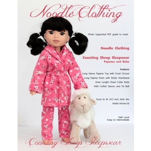May include: A pink and white pajama set with a matching robe for 14.5 inch dolls. The pajamas feature a cute sheep print. The set includes a long-sleeved top, pants, and a robe with a tie belt. The pattern includes the words "Counting Sheep".