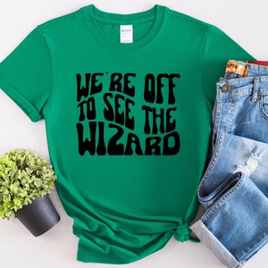 We're Off To See The Wizard Groovy Wizard of Oz Emerald City Dorothy Toto Wicked Witch Scarecrow Tin Man Cowardly Lion Unisex T-Shirt