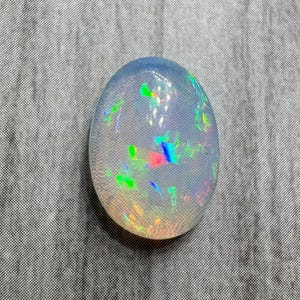 Opal cabochon. US seller. Great fire multi colors. Daily shipping. Genuine and natural stone. Ethiopian opal. Oval shape domed.