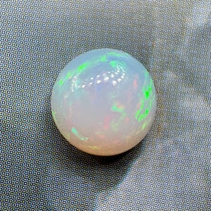 Opal cabochon. US seller. Great fire multi colors. Daily shipping. Genuine and natural stone. Ethiopian opal. 8.7 mm round shape domed.