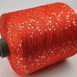 1 spool 1,1 kgs sequin yarn  Nm 5,2 luminious orange 5.200 m/kg on cone