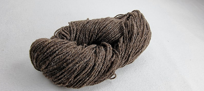 May include: A skein of brown yarn, perfect for knitting or crocheting.