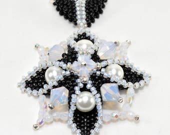 Swarovski crystals and pearls nestled in a peyote seed bead base creating a 3-dimensional star - Constellation Pendant