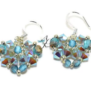 May include: A pair of silver earrings with blue and iridescent crystal beads.
