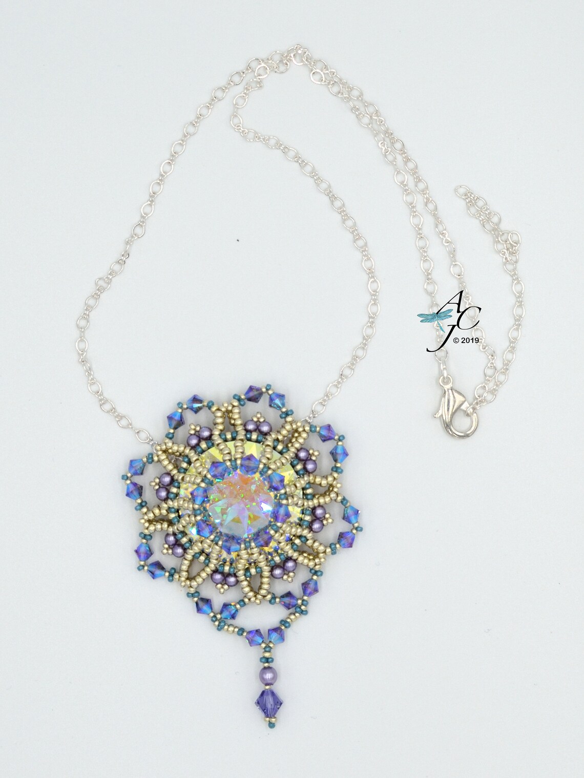 Use RAW and Netting to Weave a Beautiful Bezel for a 27mm Swarovski ...