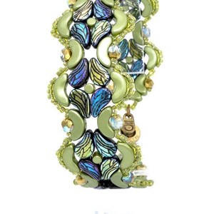 May include: A green and blue beaded bracelet with a decorative clasp. The bracelet is made of small, round beads and is arranged in a geometric pattern.