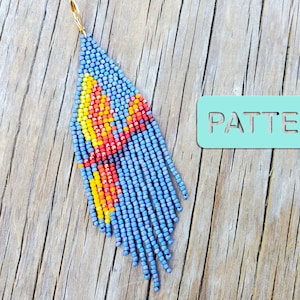 May include: A blue, red and yellow beaded earring with a gold hook. The earring is hanging from a wooden surface with the word "PATTERN" written on a light blue tag.