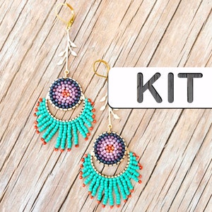 May include: A kit for making beaded earrings. The earrings feature a turquoise and orange fringe with a purple and black beaded circle in the center. The word "KIT" is printed on a white label.