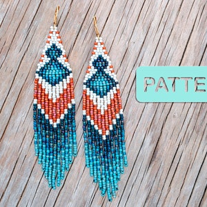 May include: A pair of beaded earrings with a geometric pattern in shades of blue, white, and orange. The earrings have gold-coloured hooks and a fringe of blue beads. The word "PATTERN" is visible.