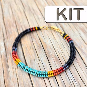 May include: A beaded bracelet kit with black, turquoise, red, yellow, and gold beads. The kit includes all the materials needed to make a bracelet.