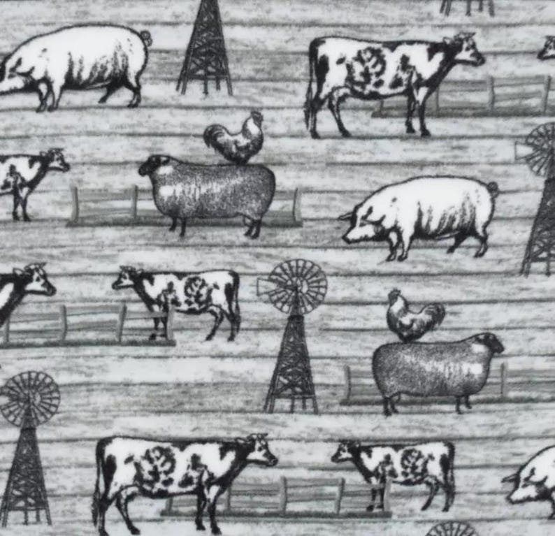 May include: Black and white farm-themed fabric featuring illustrations of cows, pigs, sheep, chickens, windmills, and fences. The design is repeated across a light gray, wood-grain textured background.