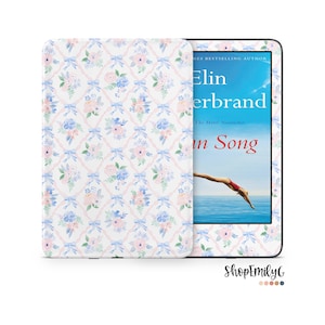 May include: A white e-reader with a floral pattern on the back. The screen shows a book cover with the title "In Song" by Elin Hilderbrand.