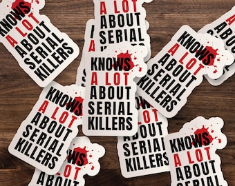 May include: A collection of white die-cut stickers featuring the black text "KNOWS A LOT ABOUT SERIAL KILLERS" with the word "A LOT" in red. Each sticker includes a red graphic resembling a blood splatter behind the word "A LOT".