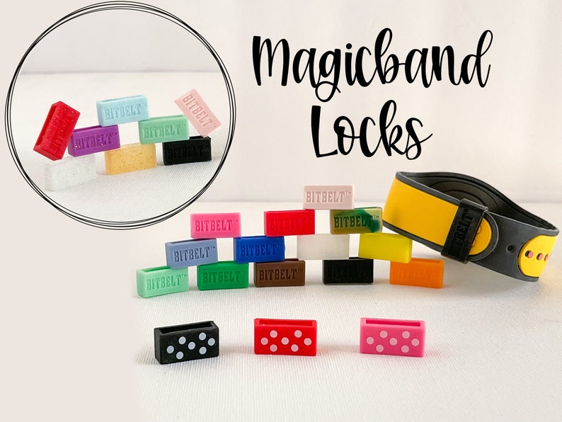 May include: A selection of colourful silicone Magicband locks with the text "BITBELT" printed on them. The locks are designed to fit on a Magicband, a wristband worn at theme parks. There are also three locks with polka dot patterns: black and white, red and white, and pink and white.