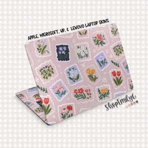May include: A laptop skin with a floral stamp design. The skin is light pink and features various flower illustrations in postage stamp shapes. Text at the top reads "APPLE, MICROSOFT, HP, & LENOVO LAPTOP SKINS". The ShopEmilyG logo is visible on the bottom right.