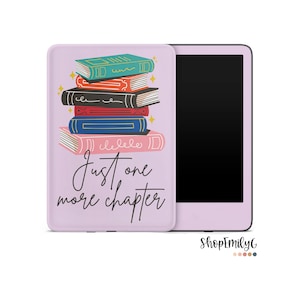 May include: A purple Kindle e-reader case with a stack of colorful books and the text "Just one more chapter".